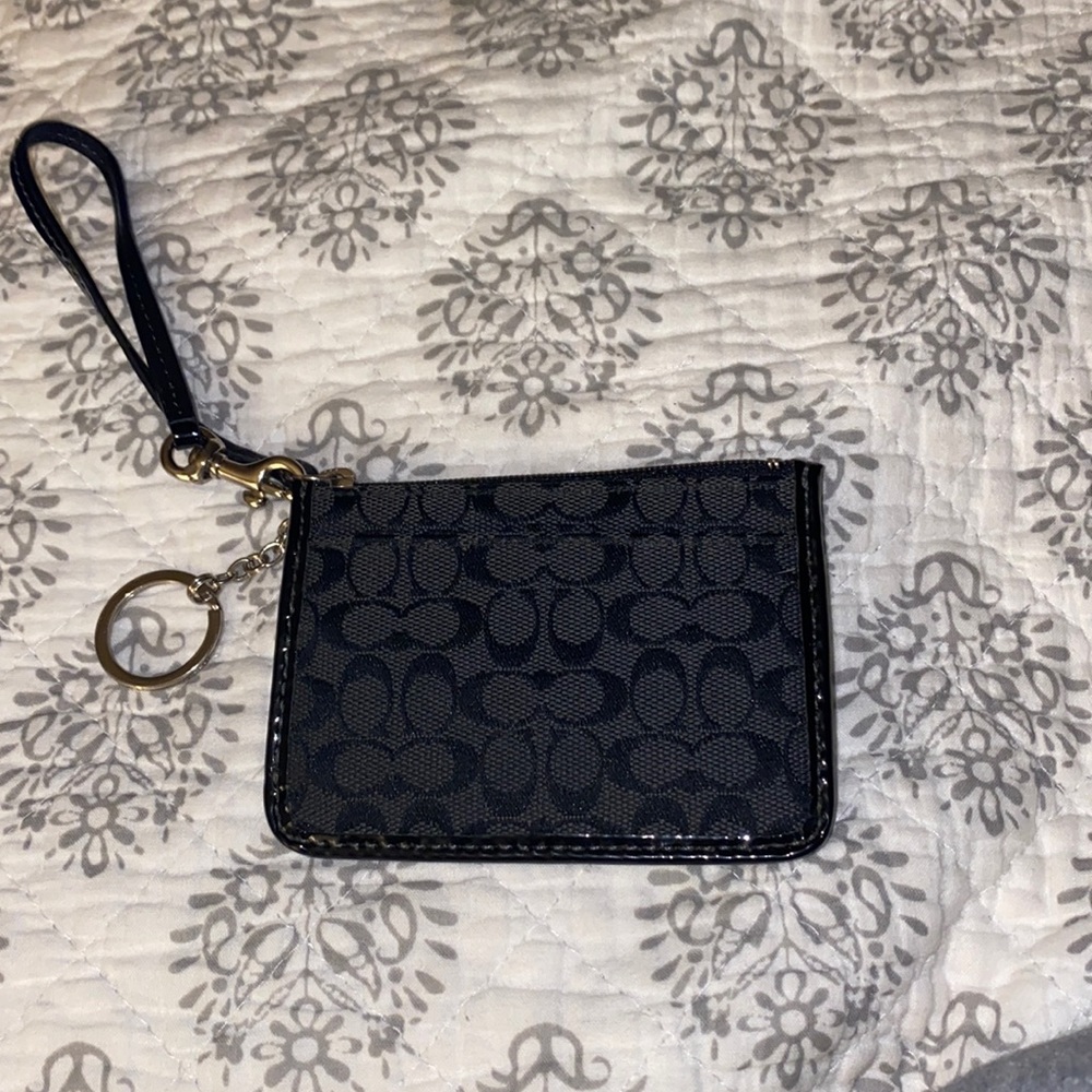 Black Coach credit card/ID zipper pouch.